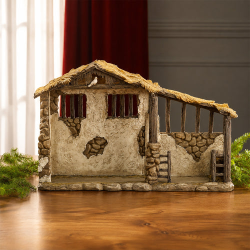Lighted Nativity Stable – 14-Inch Scale, shown in a lifestyle setting